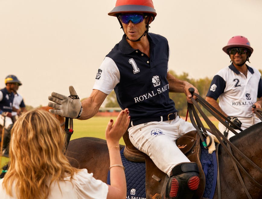 people person equestrian mammal team team sport polo glove helmet glasses